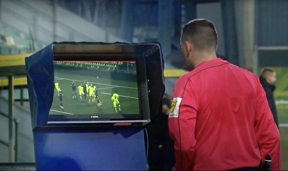 Field referee at the video review station